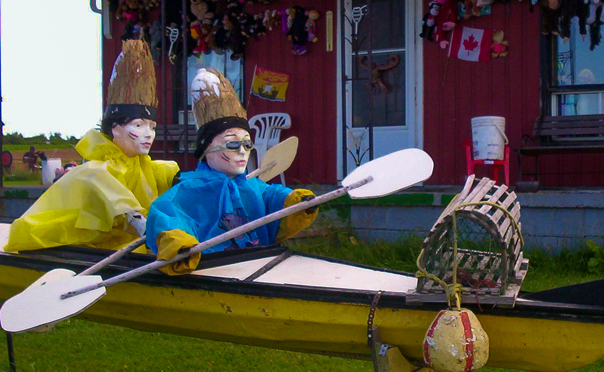 found art sculputre of two manequins in a kayak