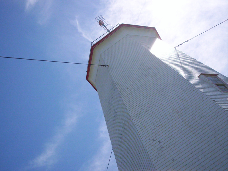 looking up at lighthouse on a sunny day
